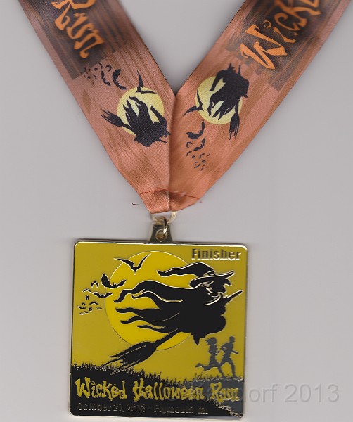 2013 Wicked 10K 210.jpg - The finisher's medal. Spooky!